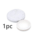 Silver neodymium magnet disc 14x2mm on plain background