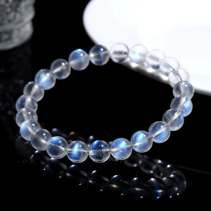 Natural cream body blue moonlight crystal bracelet with grinding finished beads on wrist