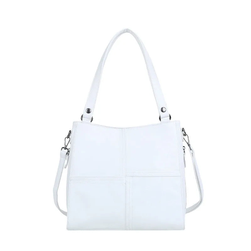 Barrel-shaped crossbody handbag in soft PU leather measuring 30 by 31.5 centimetres