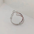 Gold and silver adjustable opening fashion ring with spherical design on a brass base.