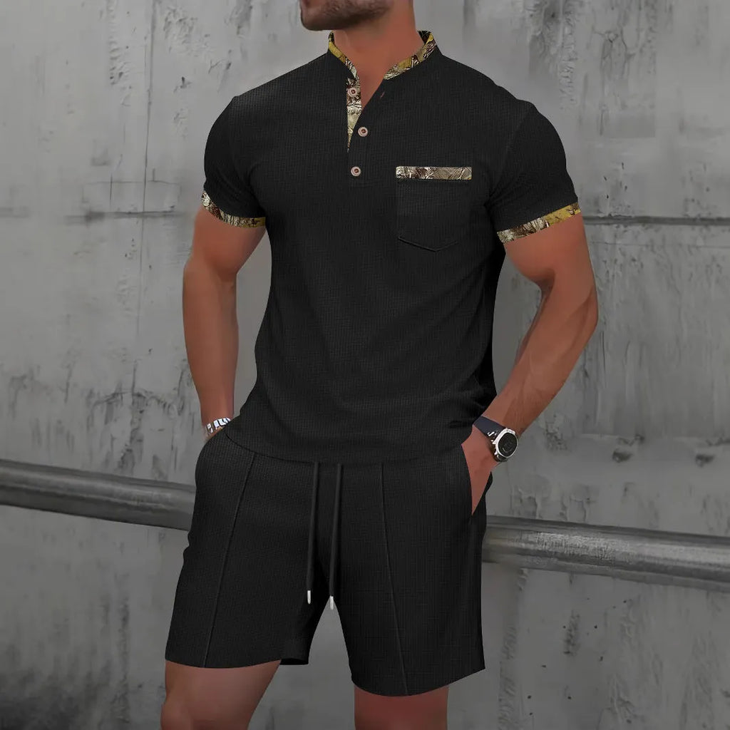 Men's grey waffle weave zippered polo collar short sleeve top and matching shorts suit set laid flat.