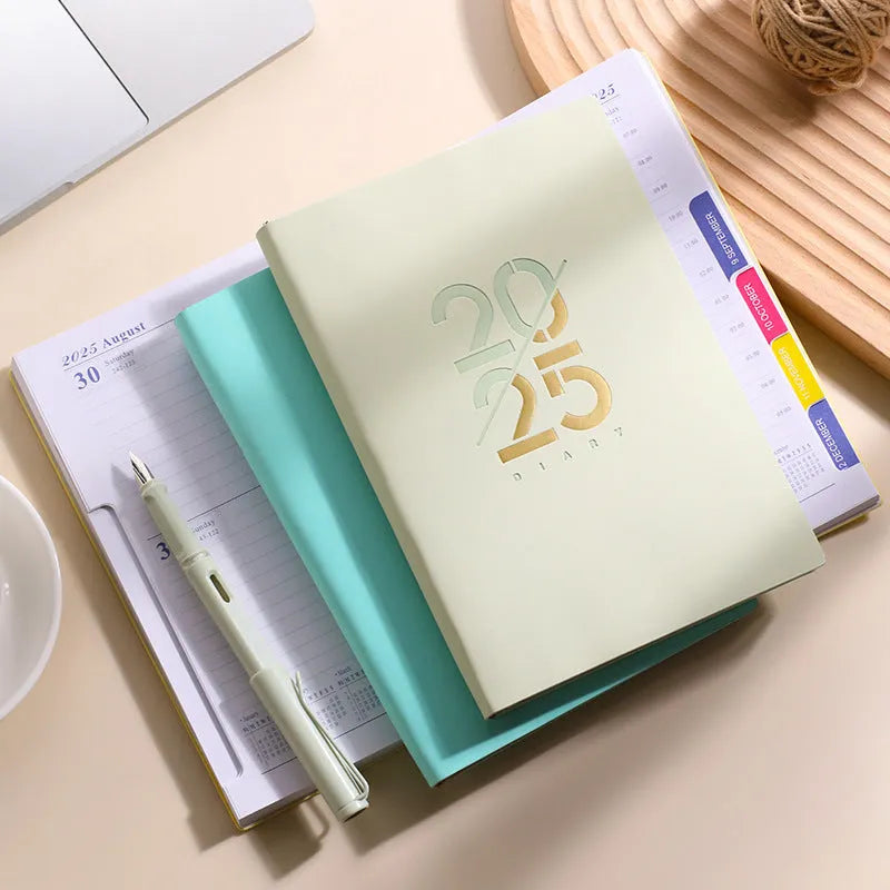 A5 daily planner with faux leather cover in blue, showing open pages of Dorian paper
