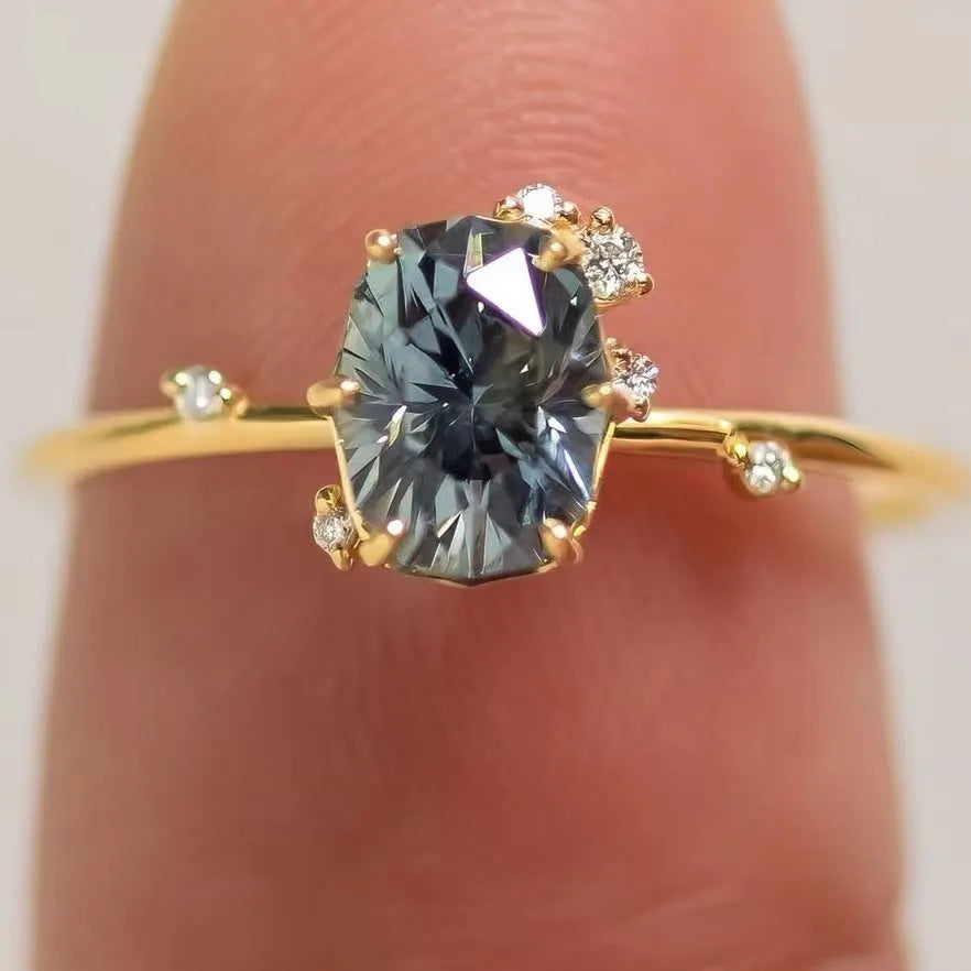 Gold-plated women's ring with green zircon floral design showing side profile