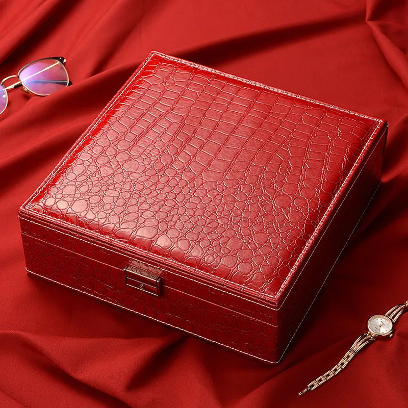 Green crocodile pattern leather double layer jewelry box with lock, showing interior compartments