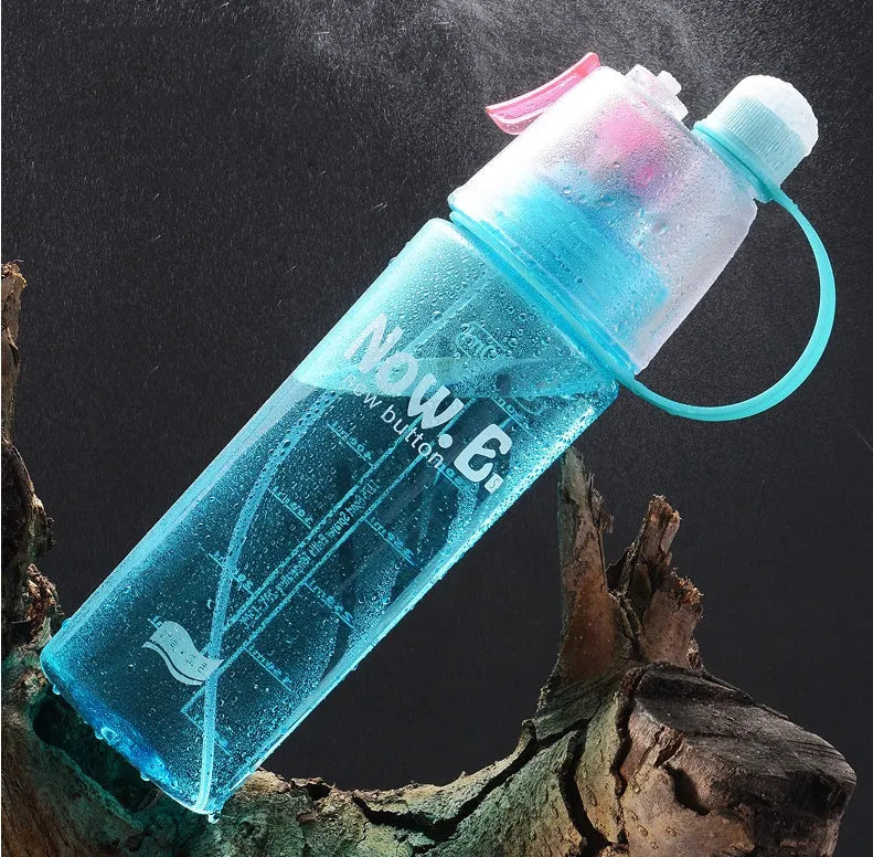 Portable sports mist spray water bottle with transparent body, handle, and mist spray function