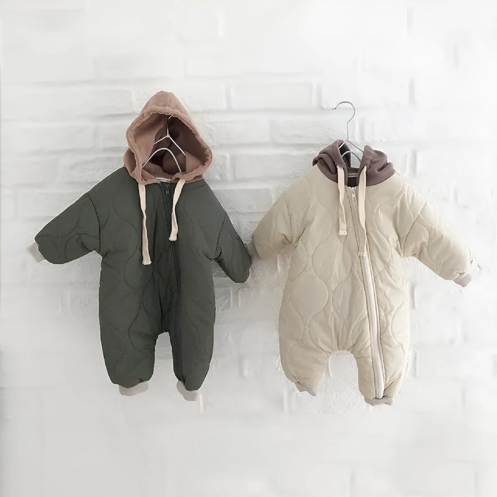 Baby padded quilted cotton kumpsuit in beige with attached hat and long sleeves, shown on a white background