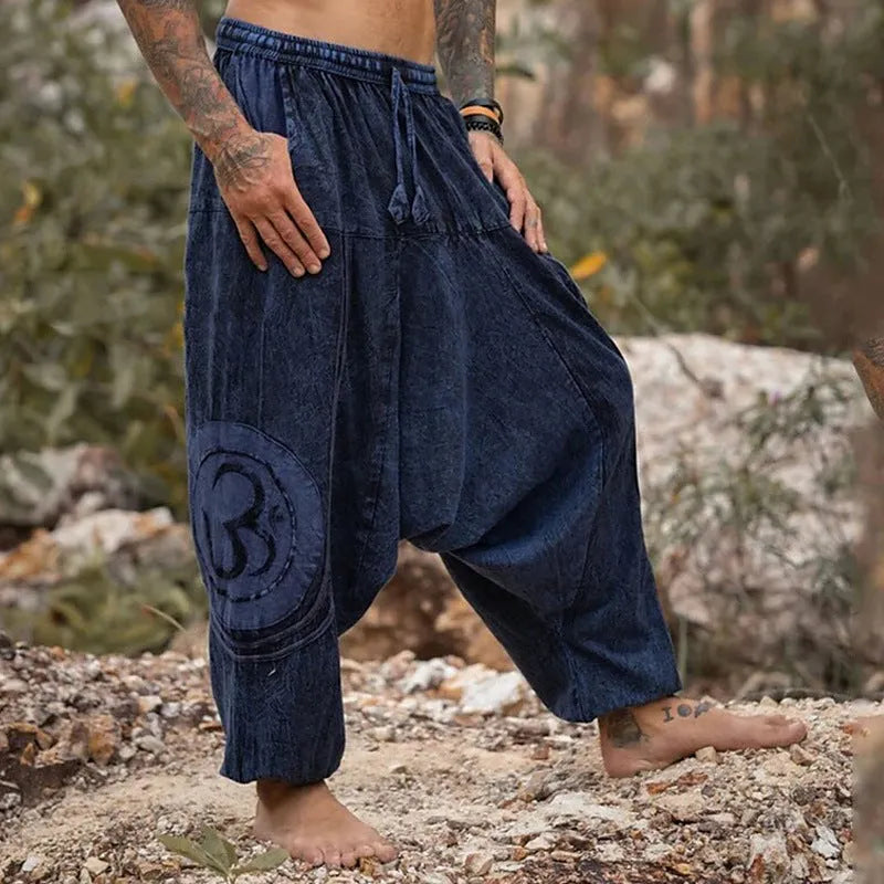 Men's dark green ethnic pattern trousers with ankle-tied design on mid waist