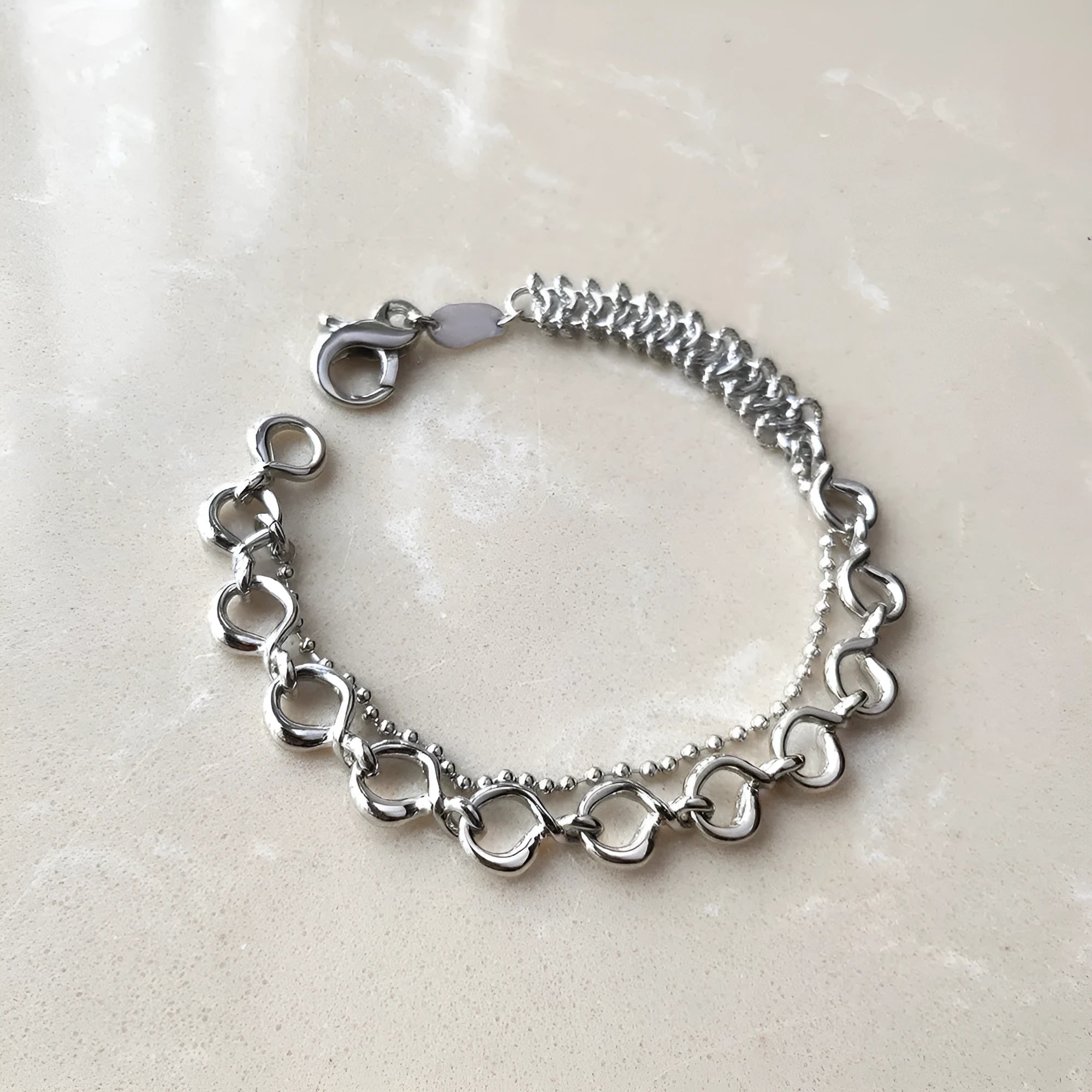 Metal wind venom splicing bracelet in silver, simple unisex design with copper and platinum plating