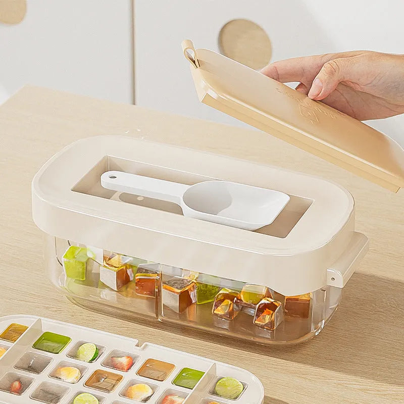 A high-capacity ice cube tray grid in a choice of colours, shown with its integrated ice shovel storage compartment.