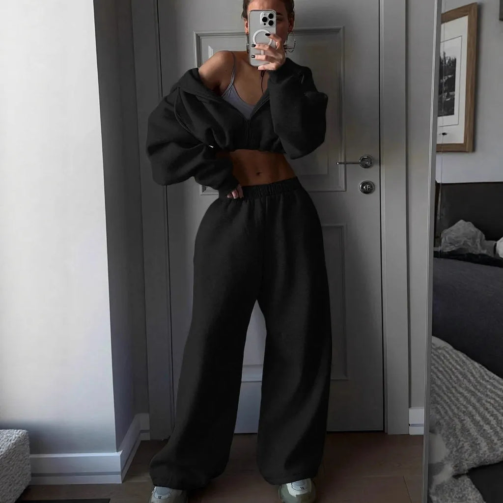 Long sleeve polyester sports suit two-piece set in light grey, shown as coat and trousers.