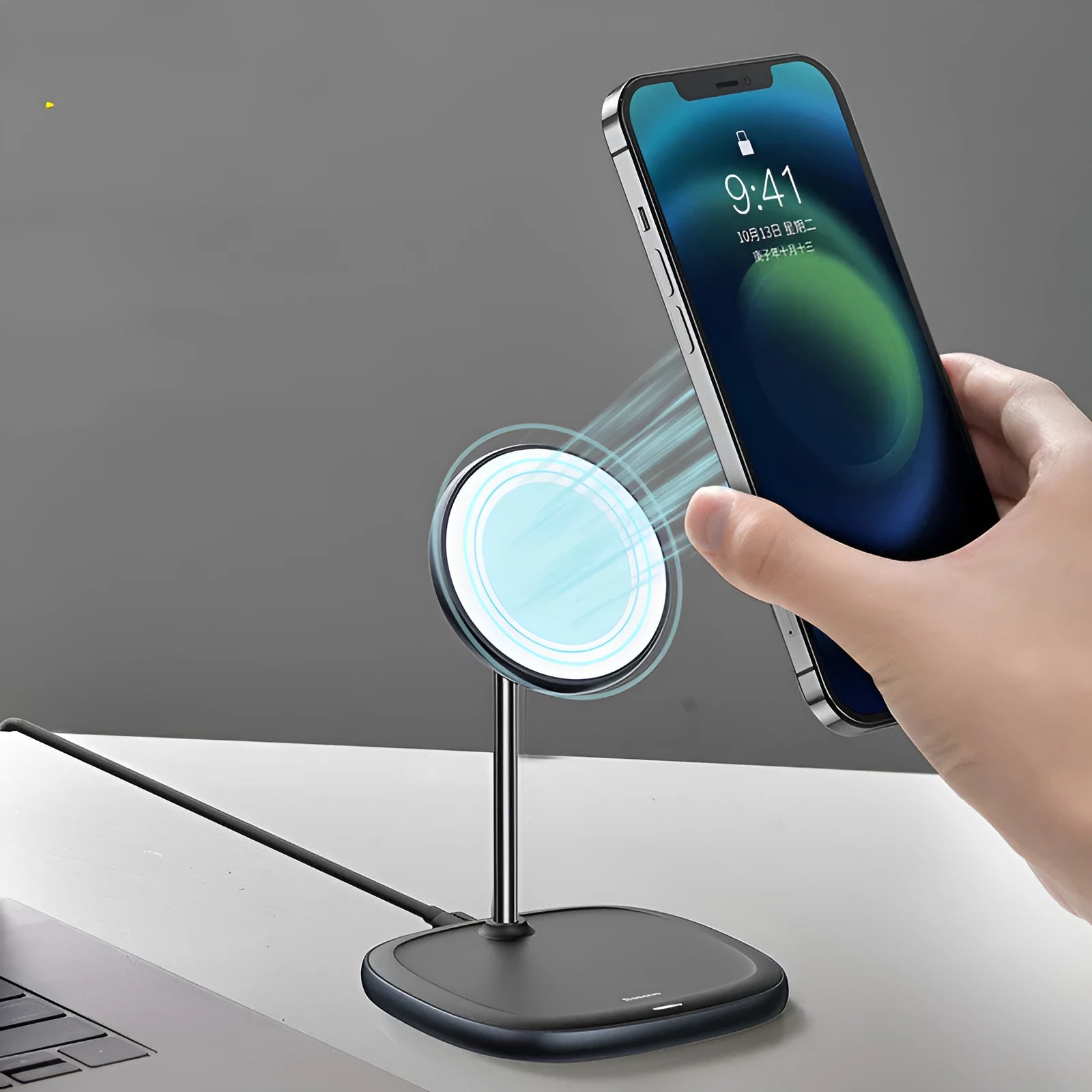 Black magnetic wireless charging stand for Apple iPhone 12 series with device attached at viewing angle