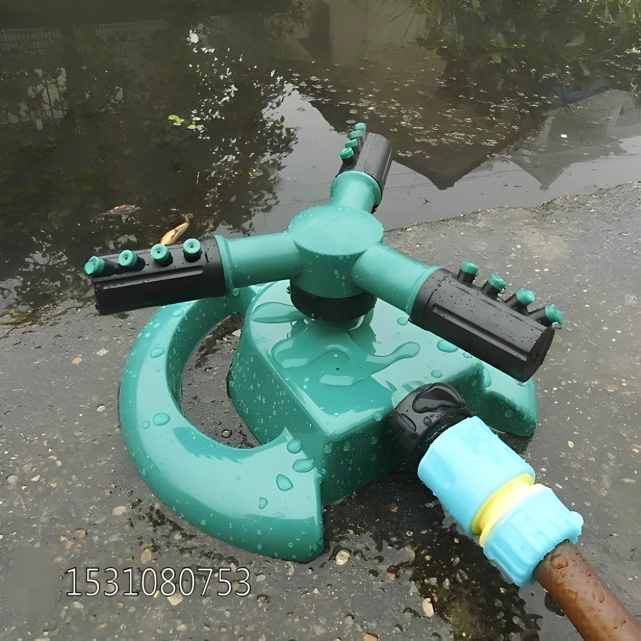 360 Rotating Sprinkler with Big 3 fork design on garden lawn, 210mm x 190mm x 95mm