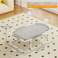 Grey fabric cat kennel with a metal bracket frame on a wooden floor.