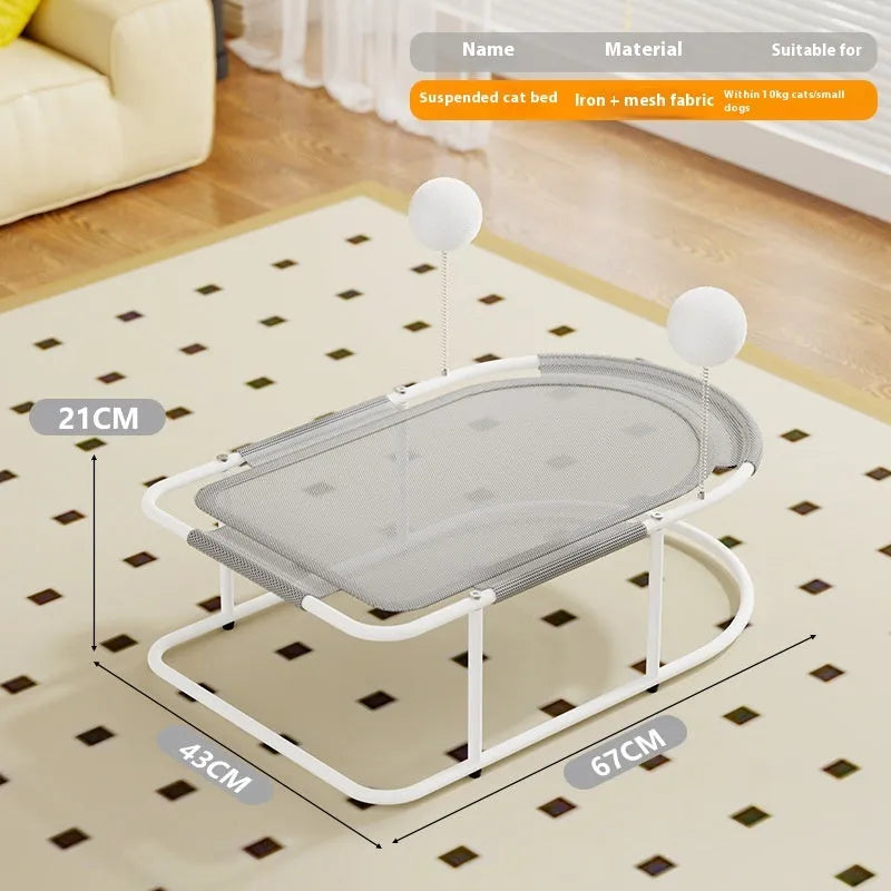 Grey fabric cat kennel with a metal bracket frame on a wooden floor.
