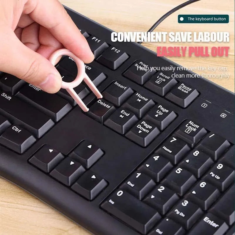 White multifunctional electronic cleaning kit with foldable pen, retractable brush, keycap puller, and spray bottle.