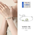Pure silver peach blossom bracelet for women with a safety buckle in a gold electroplated finish.