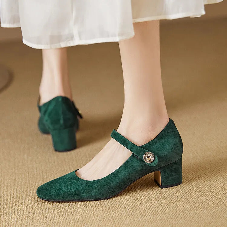 Women's black suede Mary Jane pumps with a chunky block heel and square toe on a plain background.