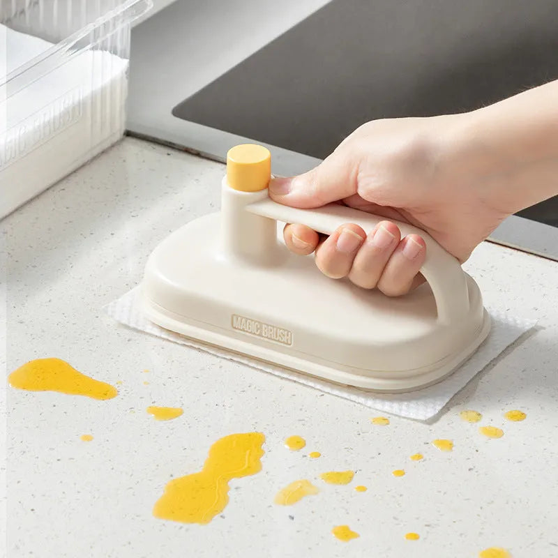 Magic disposable cleaning brush with plastic handle and packet of 50 white non-woven fabric refill wipes.