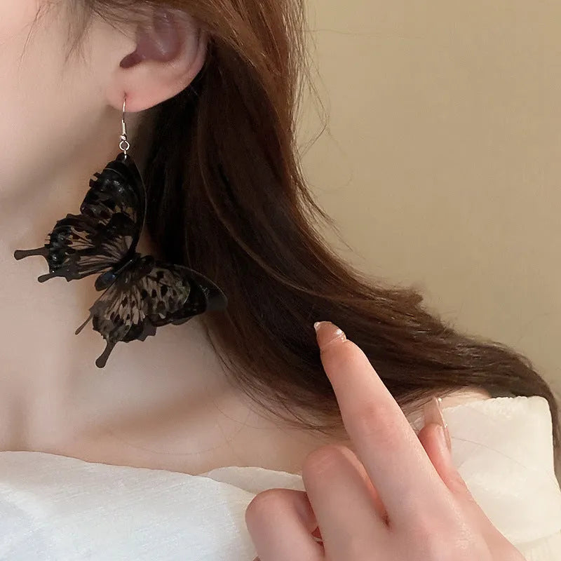 Black acrylic butterfly ear hook drop earrings with electroplated finish, 4.5 cm length