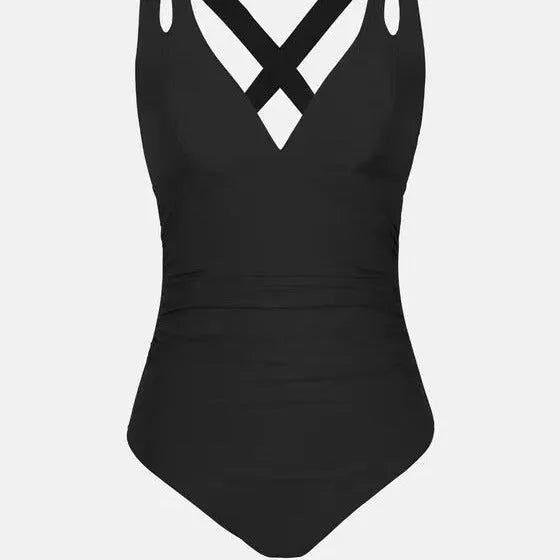 Solid colour one-piece bikini swimsuit with cross shoulder straps on a mannequin