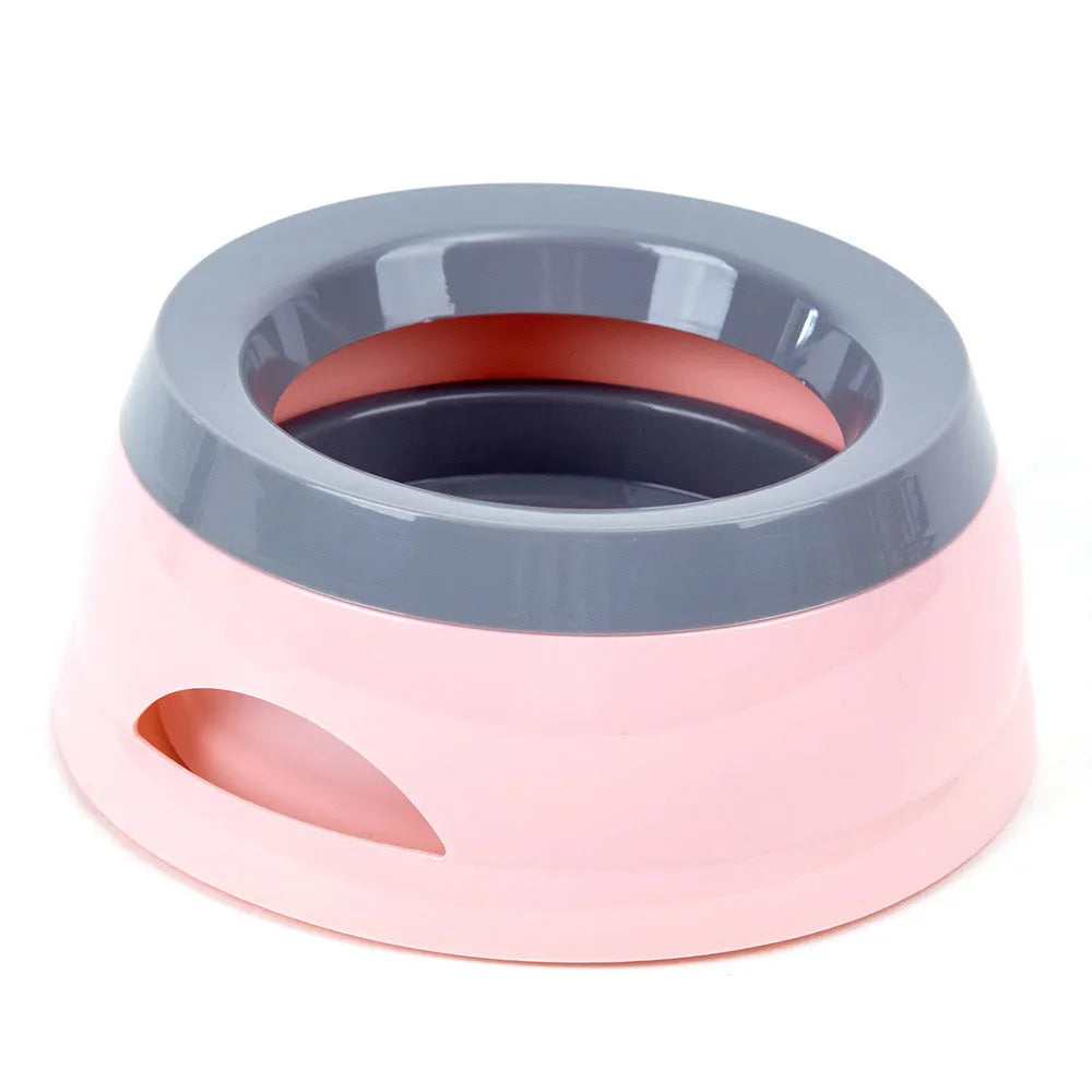 Floating no-spill pet bowl in ABS plastic, 15.3x18.9x8cm, shown in grey, green, pink or blue