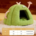 Green monster-shaped semi-enclosed cat kennel with plush velvet fabric.