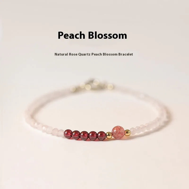 Handmade pink crystal bracelet with strawberry quartz beads and animal zodiac design