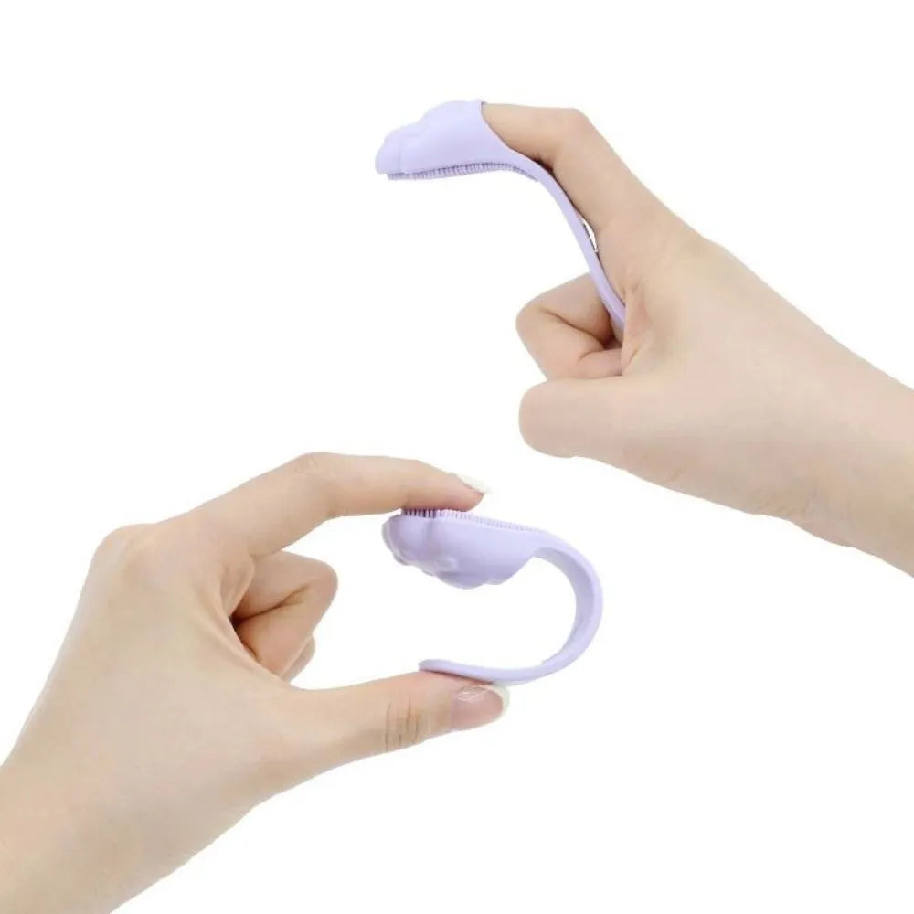 Pink silicone finger toothbrush for dogs and cats with soft nubby bristles.