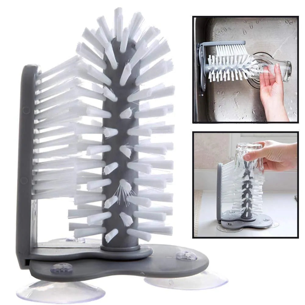 Grey 2-in-1 cup scrubber with double-sided bristles and three suction cups on a white surface