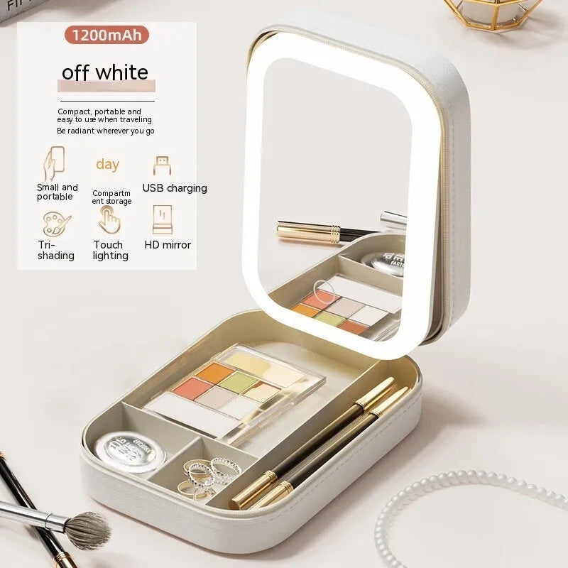 Portable LED light makeup mirror with open storage box in Cherry Blossom Pink.