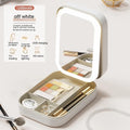 Portable LED light makeup mirror with open storage box in Cherry Blossom Pink.