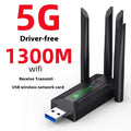 Black USB network transmitter dongle with four extended antennas for computer Wi-Fi connectivity.