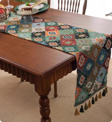 Retro style polyester table flag with long handwoven tassels on a wooden table.