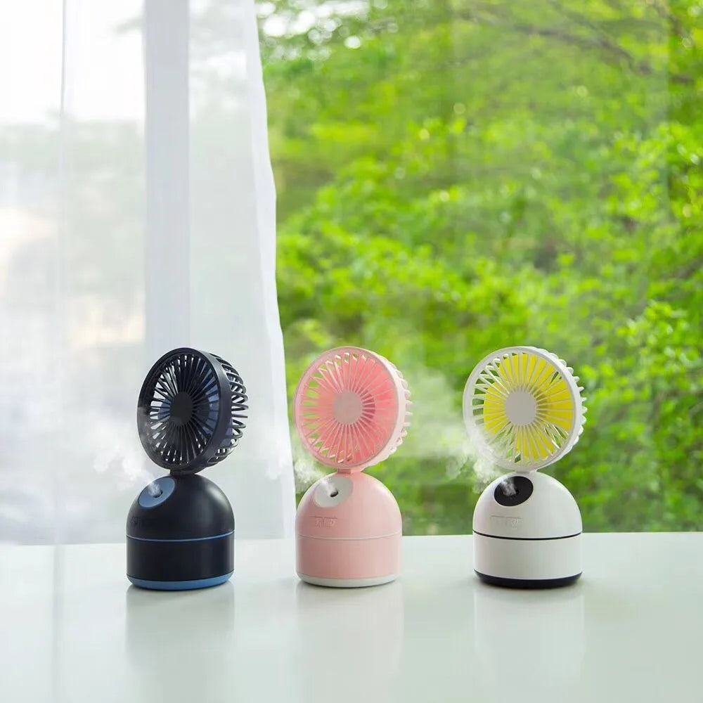 Mini USB fan humidifier in white, side view showing fan blades and mist nozzle