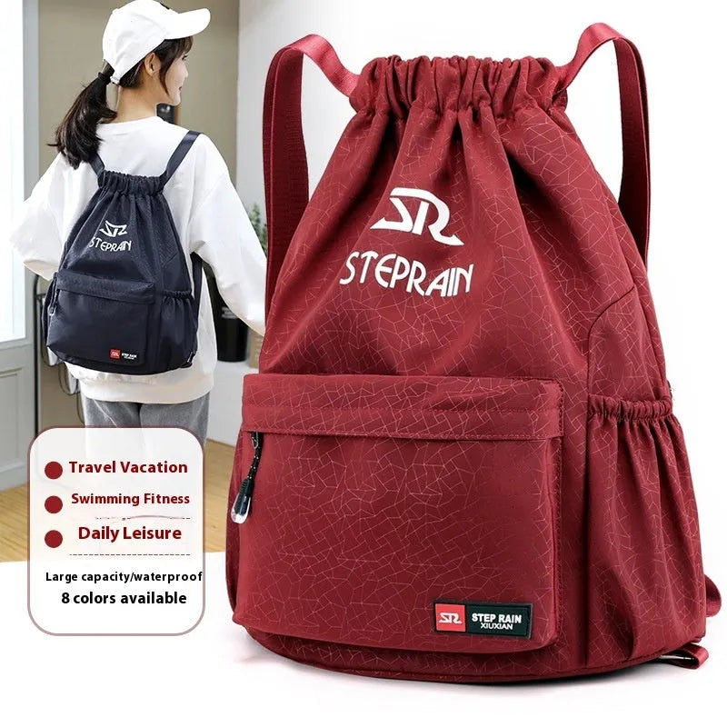 Solid colour drawstring backpack made of Oxford cloth with double shoulder straps.