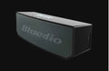 Black BS-6 Cloud Smart Speaker with micro-USB port and compact design.
