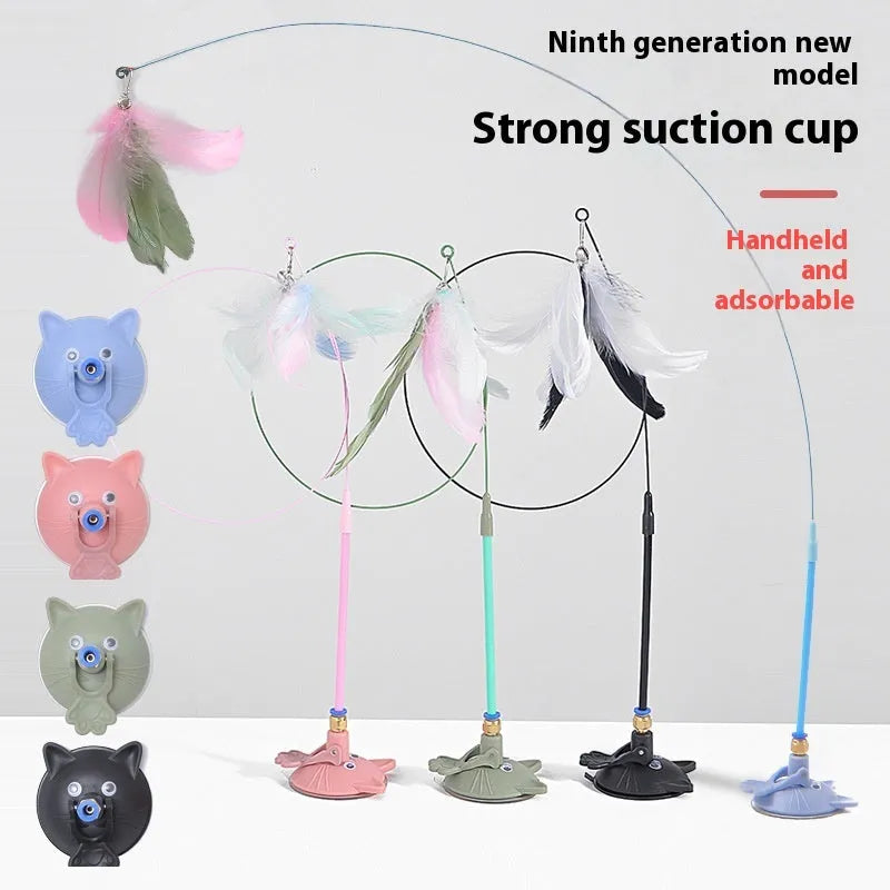 Cat teaser toy with suction cup base and long brush handle showing seven colourful attachments including cat faces and feathers
