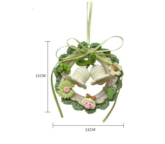 Hand-woven wool bell orchid car pendant hanging, shown in green, pink, purple and yellow colour variants.