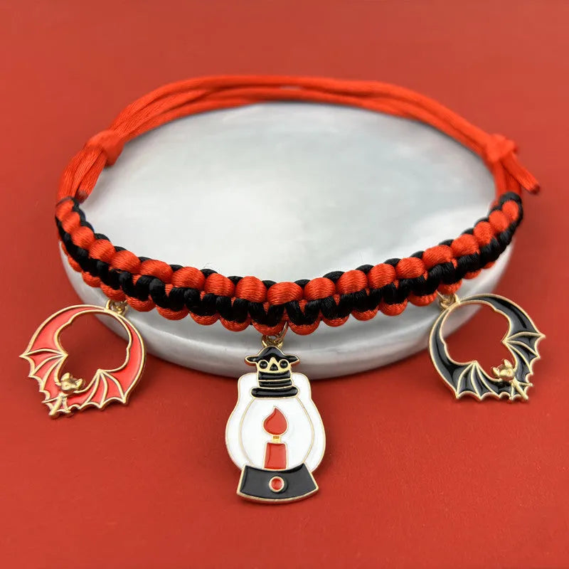 Zinc alloy Halloween charm on a pet collar, showing geometric pattern and clip.