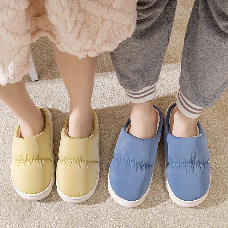Blue down cotton slippers with artificial leather uppers, thick rubber soles, and plush lining for indoor winter wear.