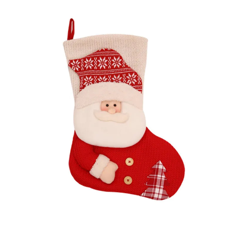 Large red and white knitted Christmas stocking with Santa Claus design hanging on a fireplace.