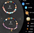 Set of two natural stone beaded bracelets showing zodiac sign symbols.