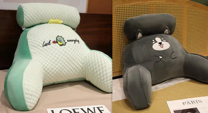 Large fluffy reading cushion with lumbar support in a dinosaur design on a sofa.
