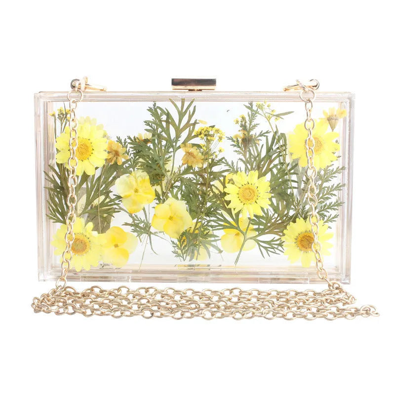 Acrylic transparent flower shoulder messenger bag with hard outer, horizontal square shape, O-shaped necklace, shown in blue.