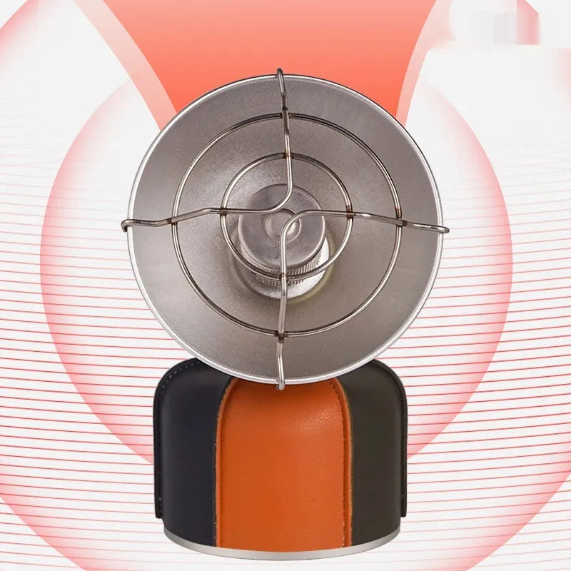Black and orange portable outdoor camping heater stove with automatic ignition on a table.