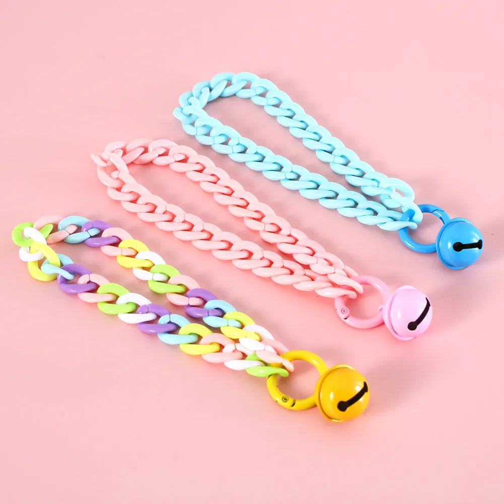 Plastic pet collar in macaron candy colours showing S and M sizes for cats, dogs, and rabbits