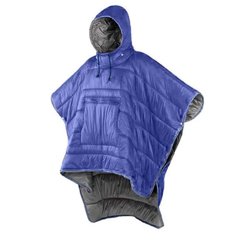 Grey outdoor cloak sleeping bag worn as a cape, showing its large 200x140cm size and hooded design.