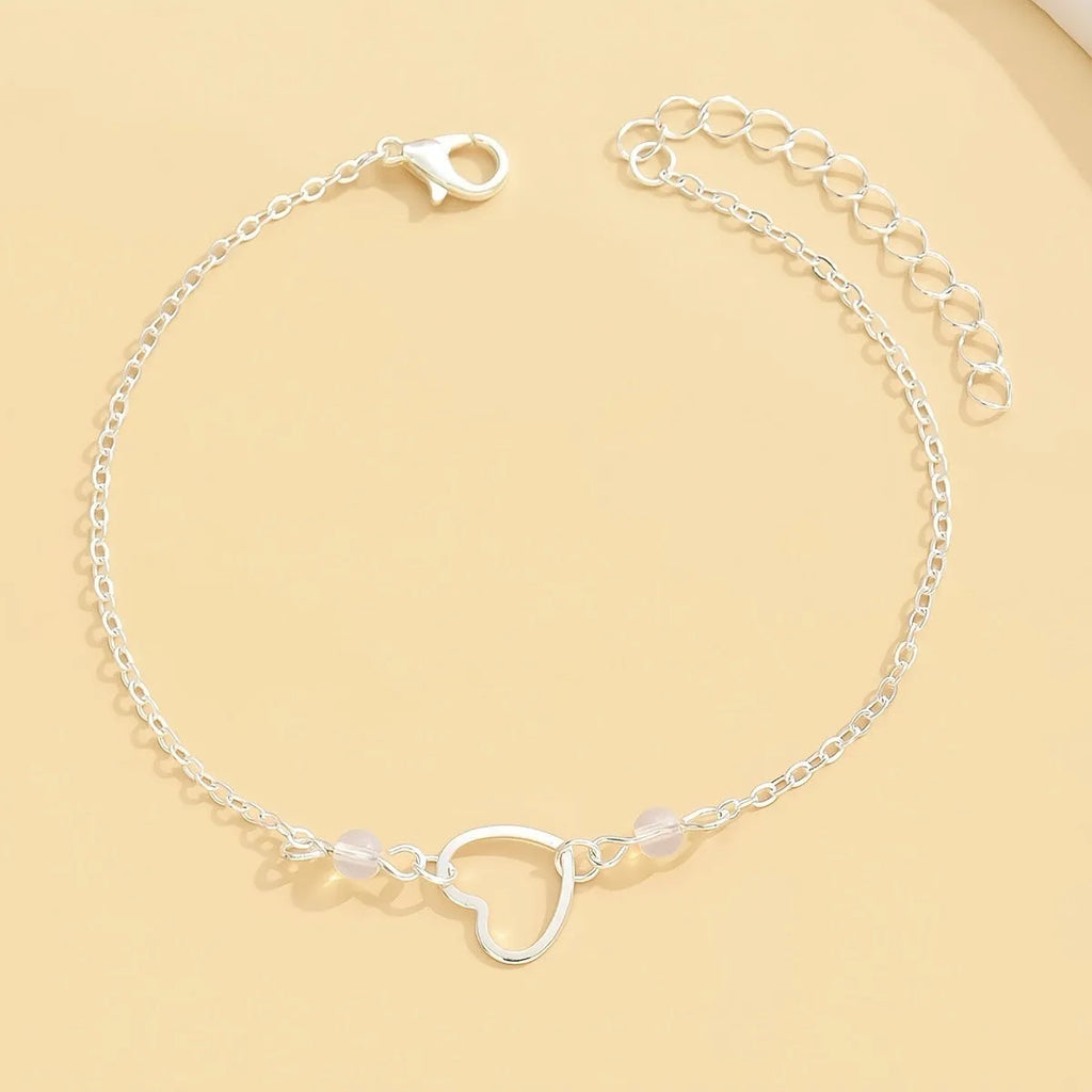 Women's geometric anklet with heart pendant on adjustable alloy chain in gold or silver finish
