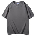 Man wearing a loose-fit 300g cotton round neck t-shirt with a print, shown in a solid colour.