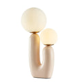Pink double-head resin table lamp with glass shades on a bedside table, 49cm height